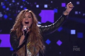 Demi Lovato sings Give Your Heart A Break on the stage of American Idol