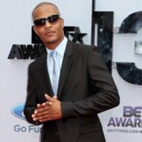 T.I. 'rewards kids with puppy'