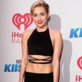 Miley Entertained by Topless Dancers